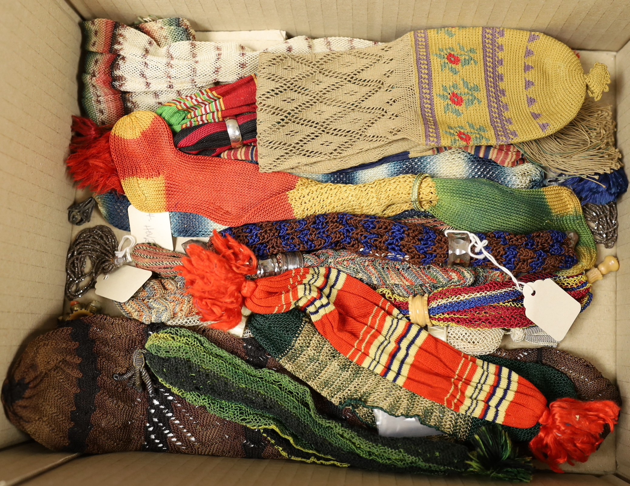 Sixteen mixed knitted misers purses, 19th century, some with Fairisle design, striped, and one novelty purse designed as a sock